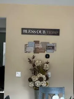 "Bless Our Home" wall decor reflecting the faith-centered, family atmosphere of Grace Refuge Recovery.