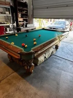 Recreation space with a billiards table for downtime and fellowship between residents.